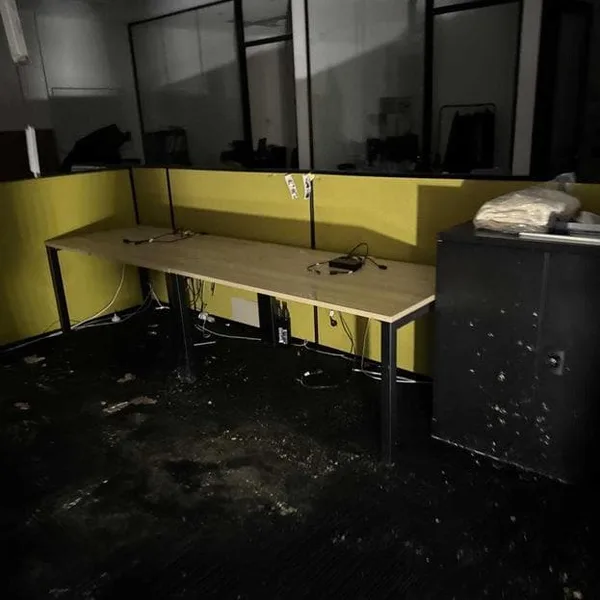 Water-damaged office area in Park Hyatt Auckland basement showing saturated carpet